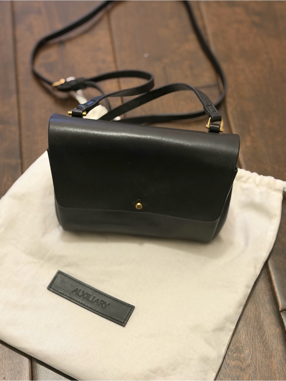 Auxiliary Black Leather Crossbody with Gold Accent